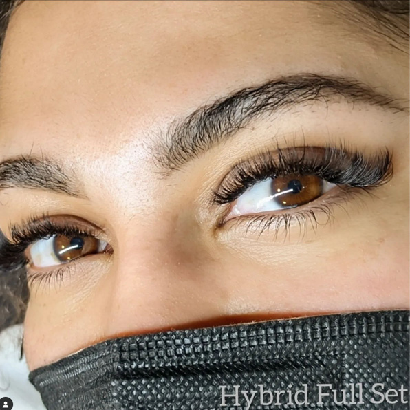 Woman with Hybrid Full Set Eyelash extensions